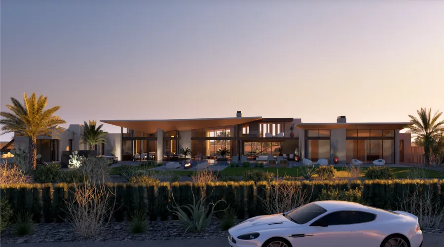 Front elevation of the residence glowing at dusk